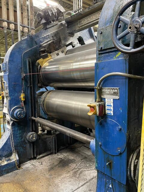 24" x 68" Adamson, 3 roll calender with a top inclined roll.